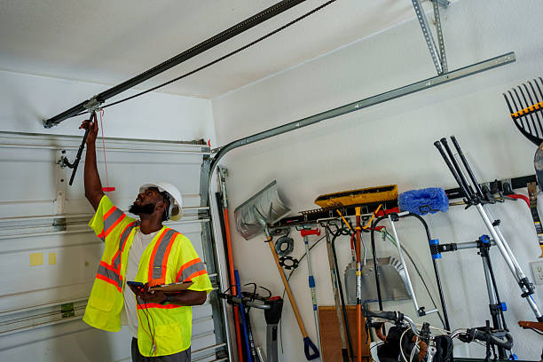 Professional Garage Door Panel Replacement technician working in Macon County County, AL